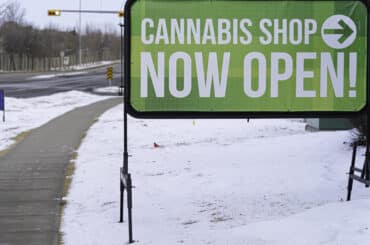 cannabis shop now open store side along the road in winter